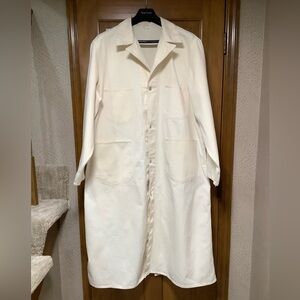 Vintage 1940s canvas twill coveralls work coat for a car dealership workshop.